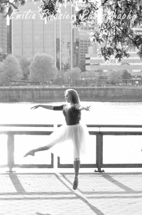 Ballerina jumping, black and white photograph taken at the Portland Waterfront